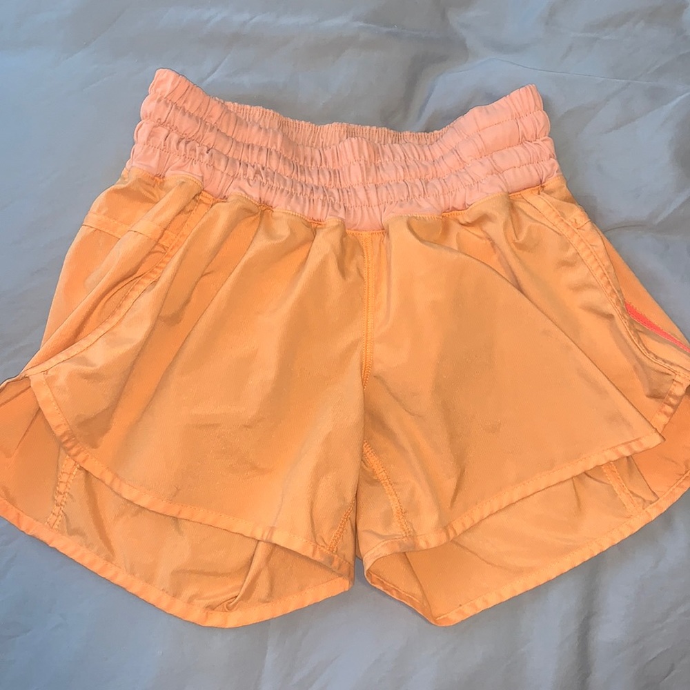 Lululemon bright orange tracker style shorts